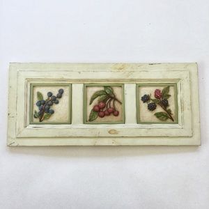 Wood panel with carved relief fruits